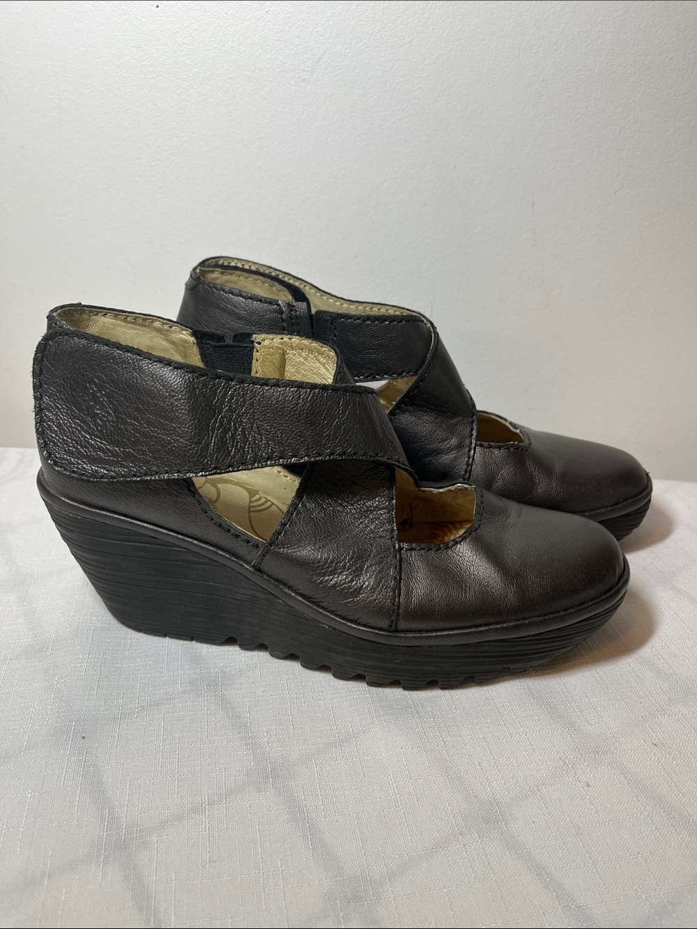 Fly London Black Leather Cutout Wedge Shoes
Size 8.5 or 39